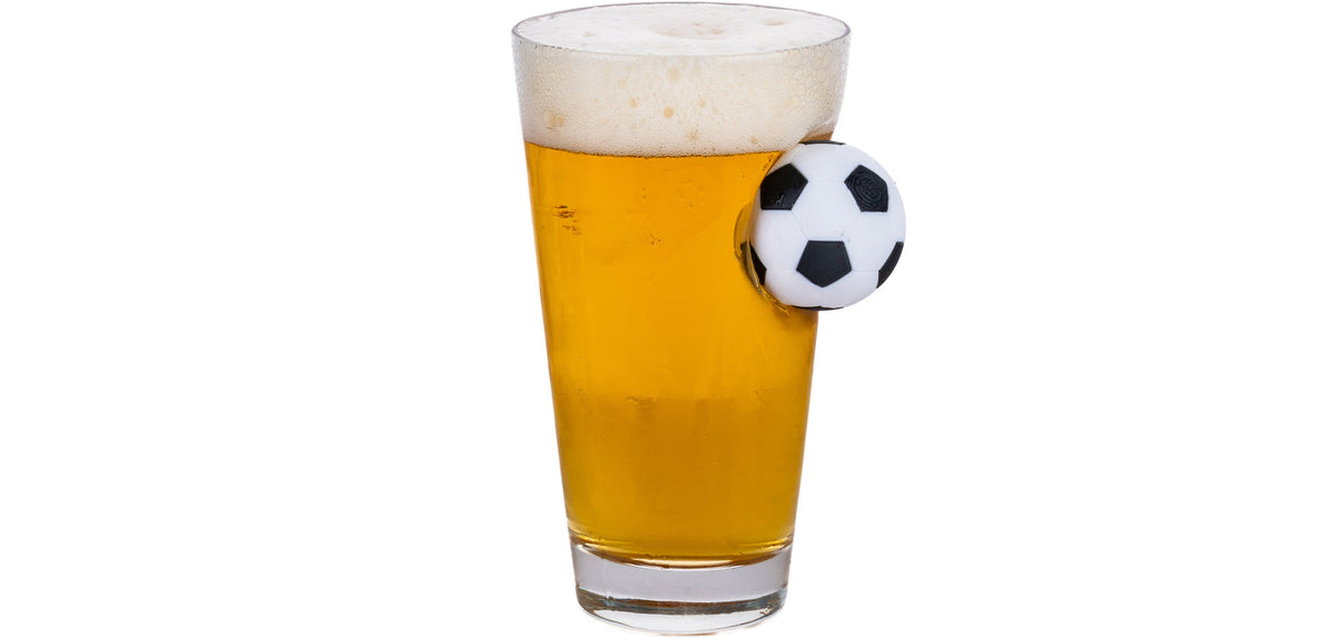 Bellore beer glass with a football set into the glass, 465 ml, filled with beer